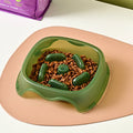 Plastic dog slow feeder bowl in blue, grey, green, or orange with anti-choking maze design