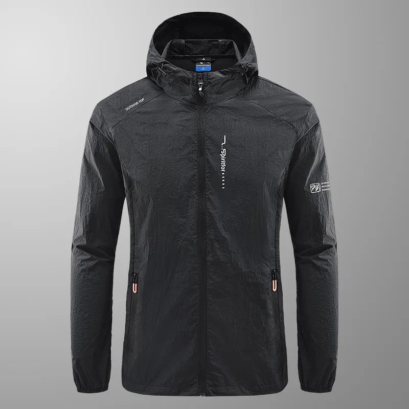 Man wearing a lightweight grey hooded summer jacket made from thin nylon fabric.