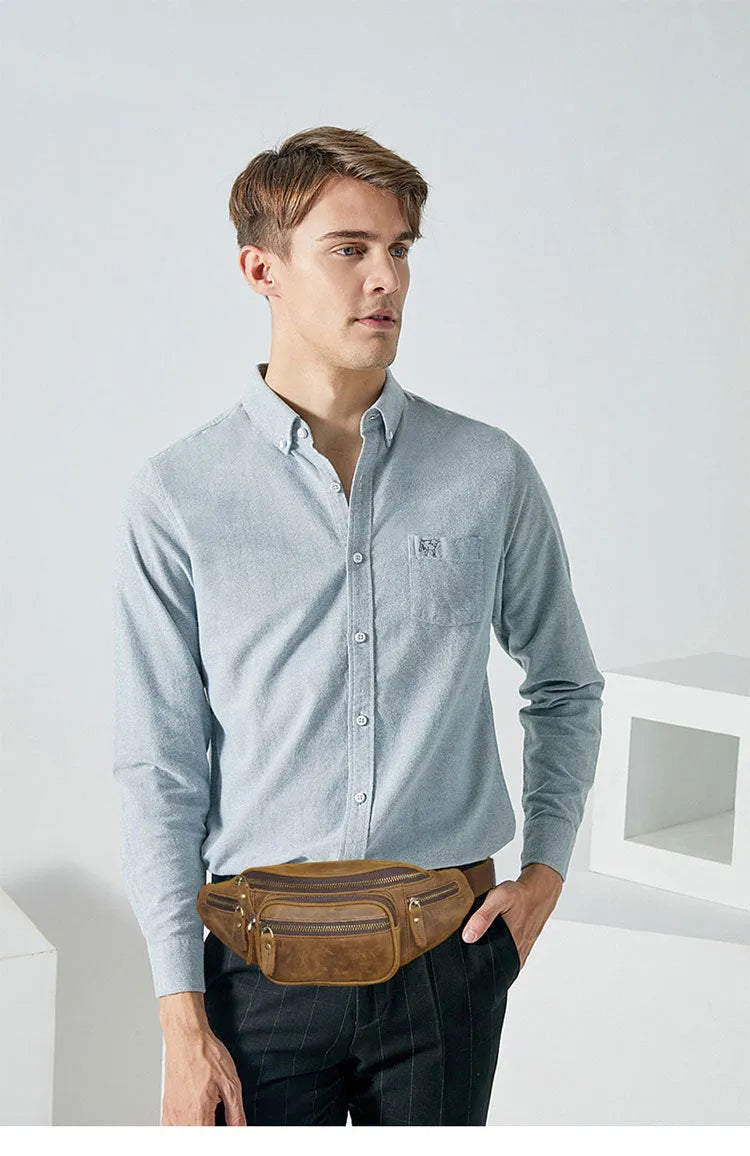 Dark brown leather messenger bag with a single shoulder strap showing its 32cm length and spacious main compartment