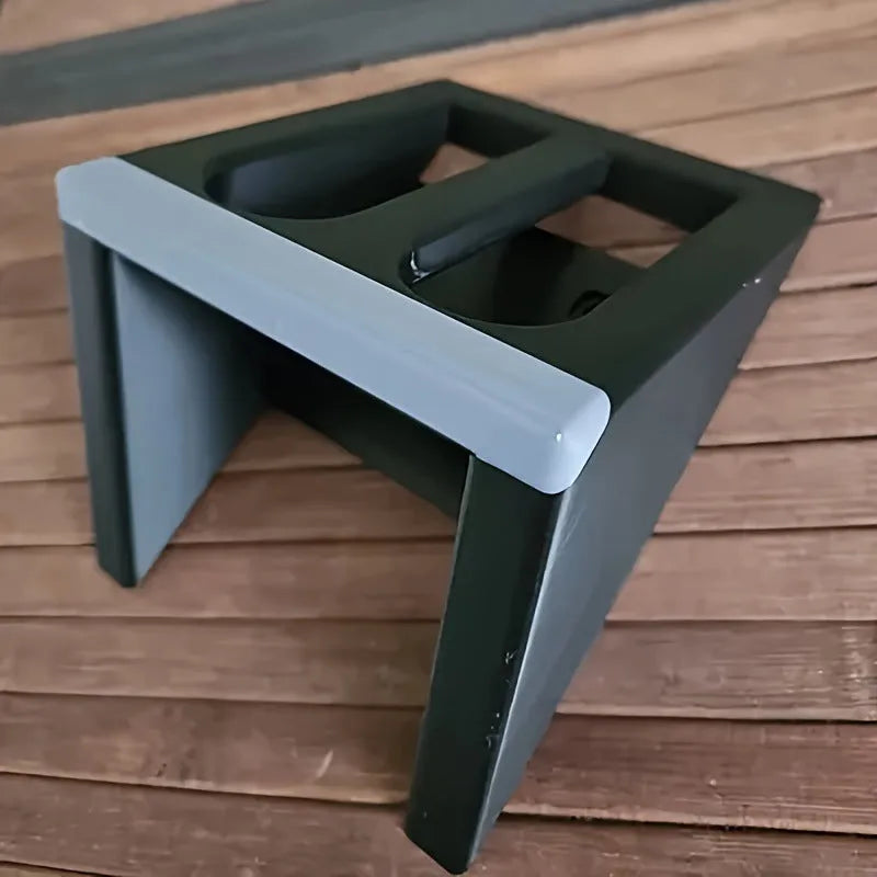 Black plastic pistol stand with punk-style design for displaying model firearms