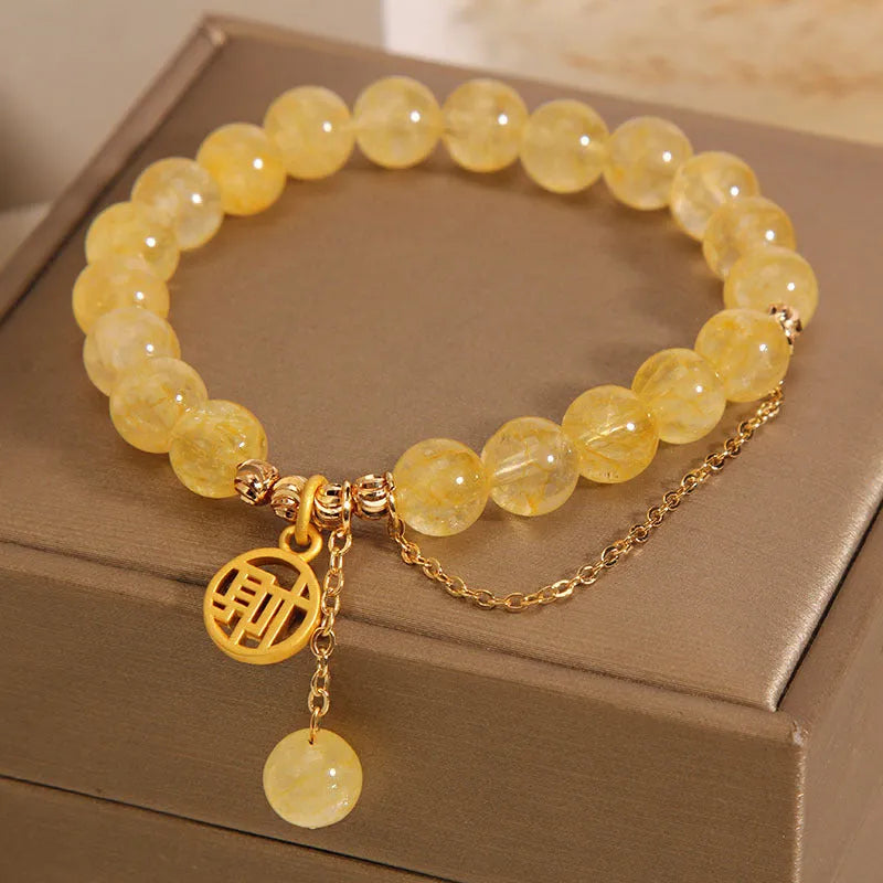 Natural citrine bracelet with Chinese character charm and decorative tassel in electroplated mixed materials