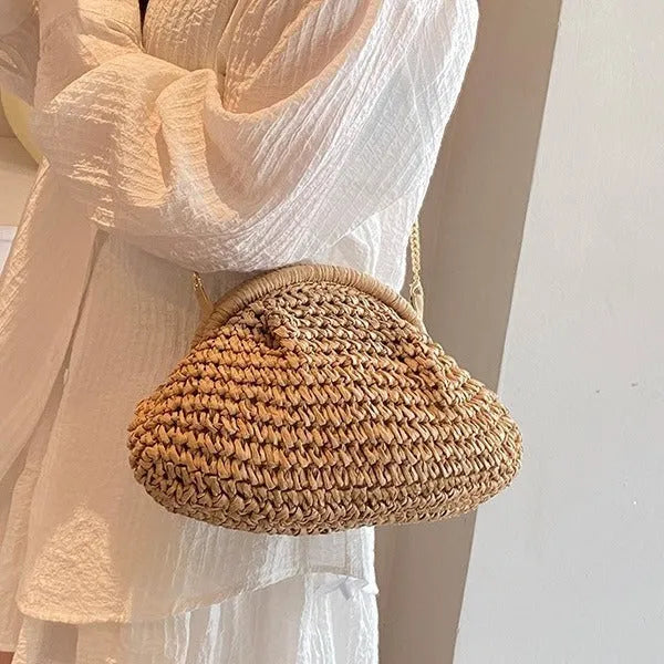 Women's shell-shaped straw shoulder bag with chain strap in khaki colour showing zippered internal pocket