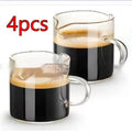 White transparent double-mouthed glass coffee cups showing two drinking openings