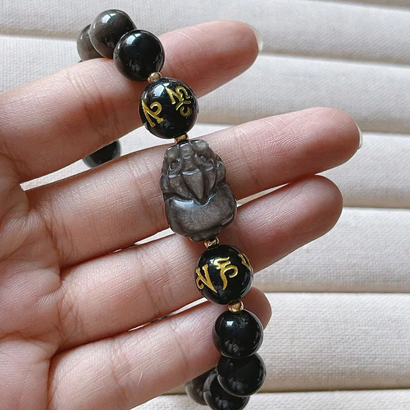 Close-up of a men's adjustable Silverstone bracelet with Chinese zodiac beads and six-word proverbs.