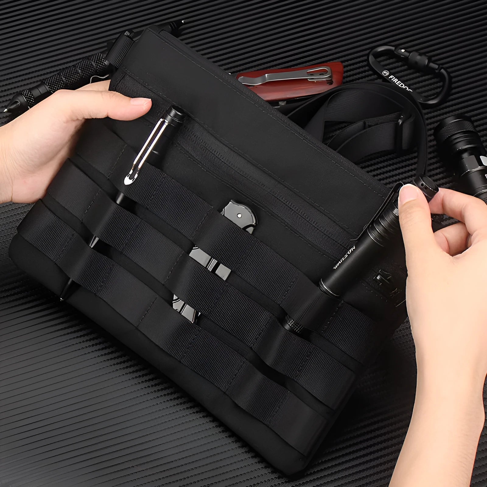 Solid black Oxford cloth portable organiser bag measuring 18cm by 3.5cm.