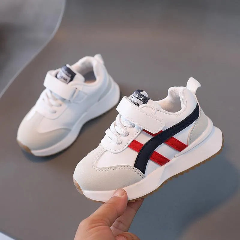 Children's white synthetic leather sneakers with Velcro strap and rubber sole in size 25