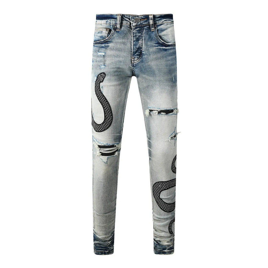 Man's blue distressed skinny jeans with a street fashion wash and button fly.