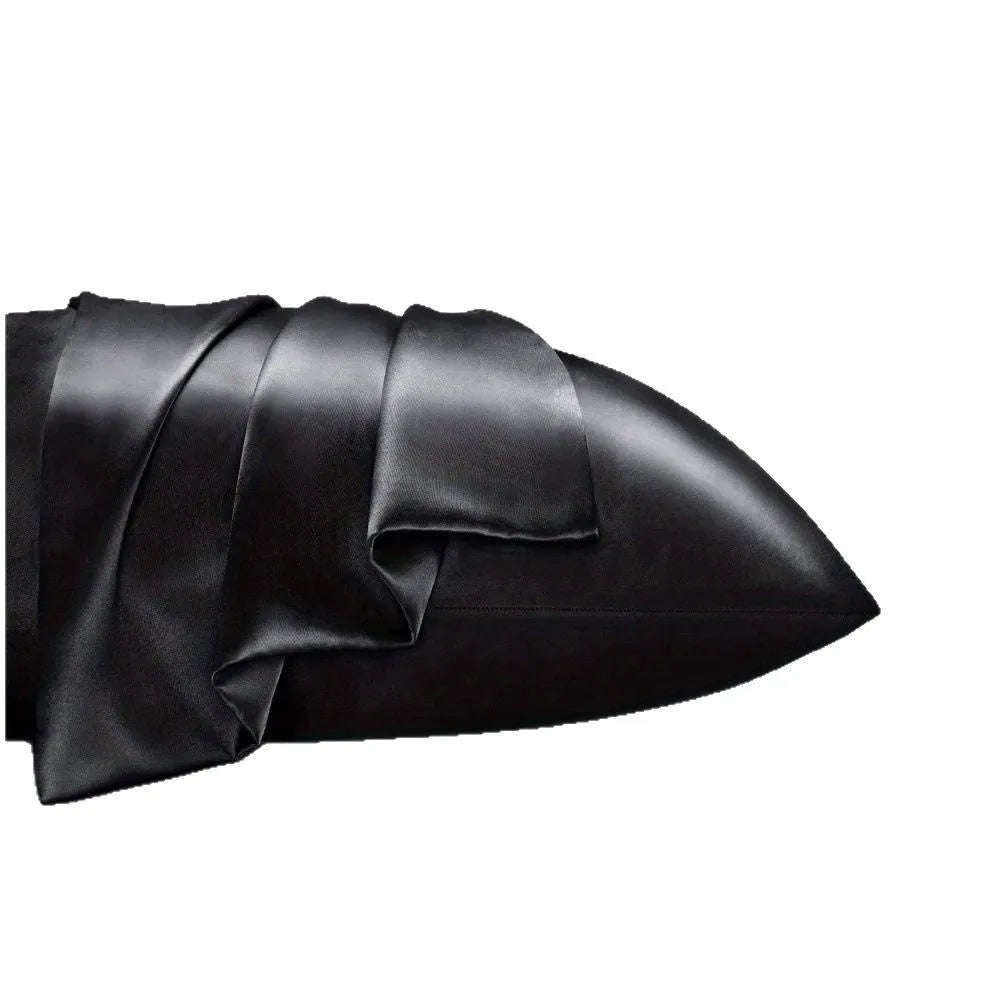 A pair of solid colour satin pillowcases in a chosen colour, showing smooth texture and plain weave fabric.