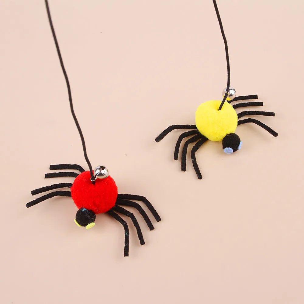 Hanging cat toy with feathers, bell and colourful spiders on elastic rope