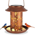 Solar-powered iron art garden lamp and bird feeder with hummingbird pattern design.