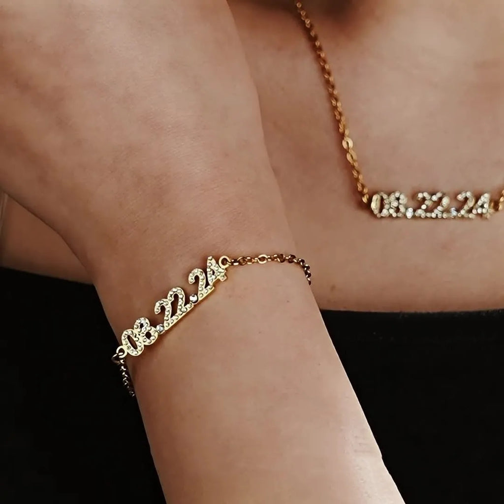 Stainless steel digital bracelet with diamond-set numbers, shown in gold, rose gold, and steel colour options.