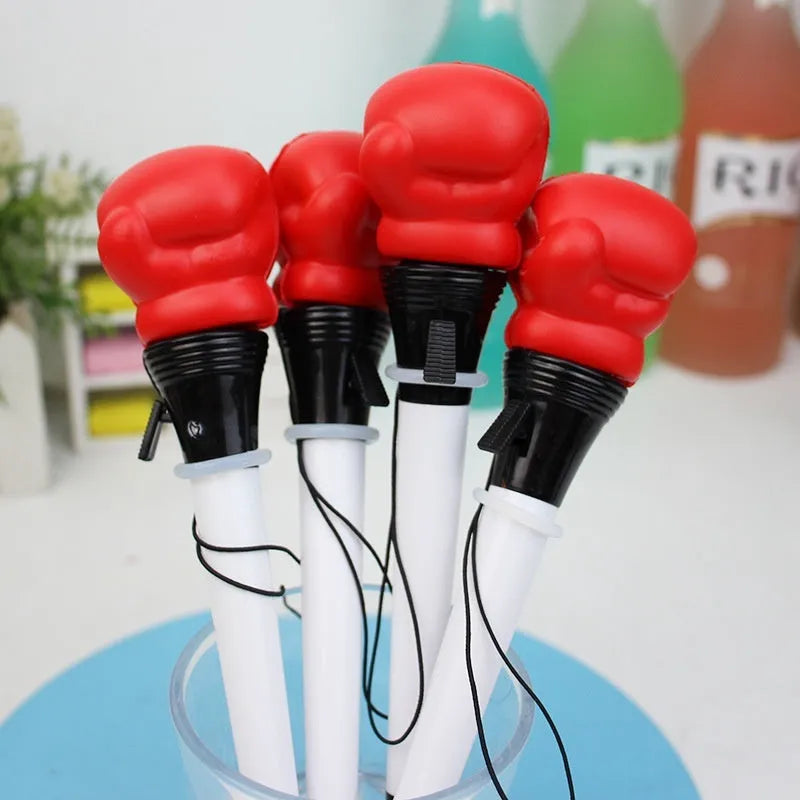 Set of four black boxing press ejection pens with bullet-shaped 0.7mm tips on a white surface.