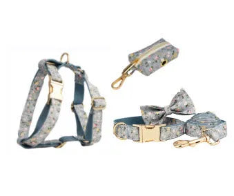 Blue floral pattern dog collar set with adjustable sizing and multiple accessory pieces
