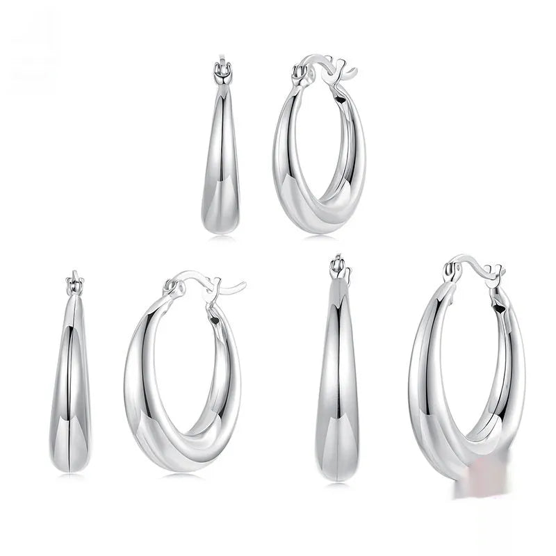 Silver-tone geometric ring clip-on earrings for women, shown in three sizes.
