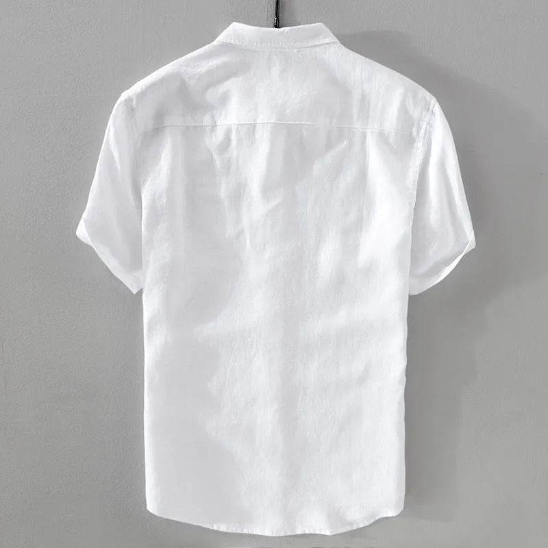 Men's loose fit short sleeve linen shirt in apricot colour on a hanger.