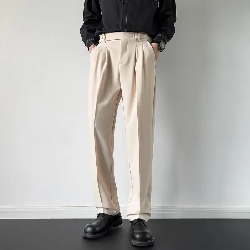 Men's straight loose fit suit trousers in apricot colour on a hanger.