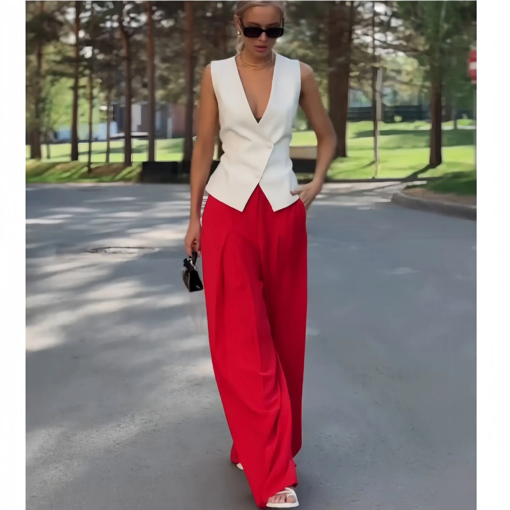 Women's beige two-piece set with deep V-neck sleeveless top and high-waist wide-leg trousers