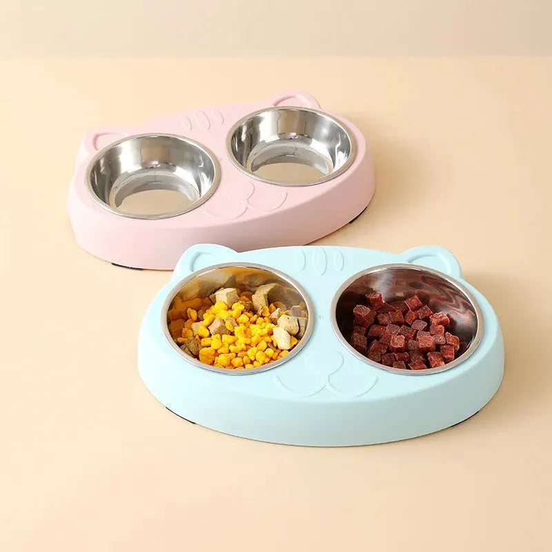 Blue plastic double bowl pet feeder tray for cats and small dogs on a floor.