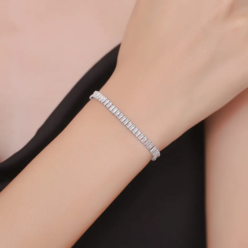 Geometric rectangular brass bracelet with zircon inlays in champagne gold or silver colour