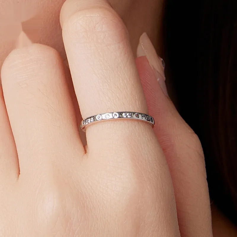 Silver ring with oxidised black I Love You moss design showing three available sizes