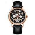 Men's black dial mechanical watch with visible golden tourbillon complication and luminous hands on a metal bracelet.