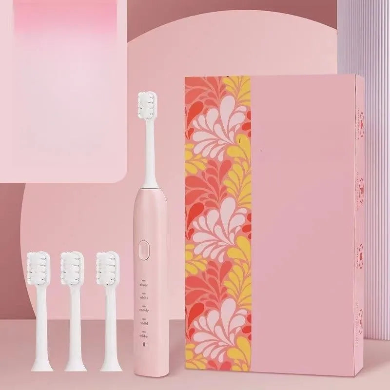 Yellow rechargeable electric toothbrush with soft bristles on a bathroom counter
