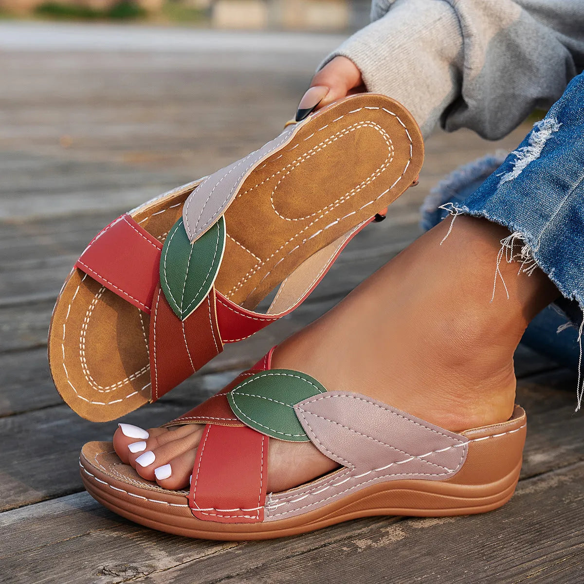 Women's black thick-soled slippers with cross-strap design and peep-toe opening