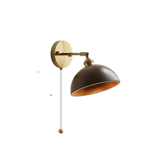 Inn Niche Nordic style wooden bedside wall lamp in walnut colour mounted on a light wall.