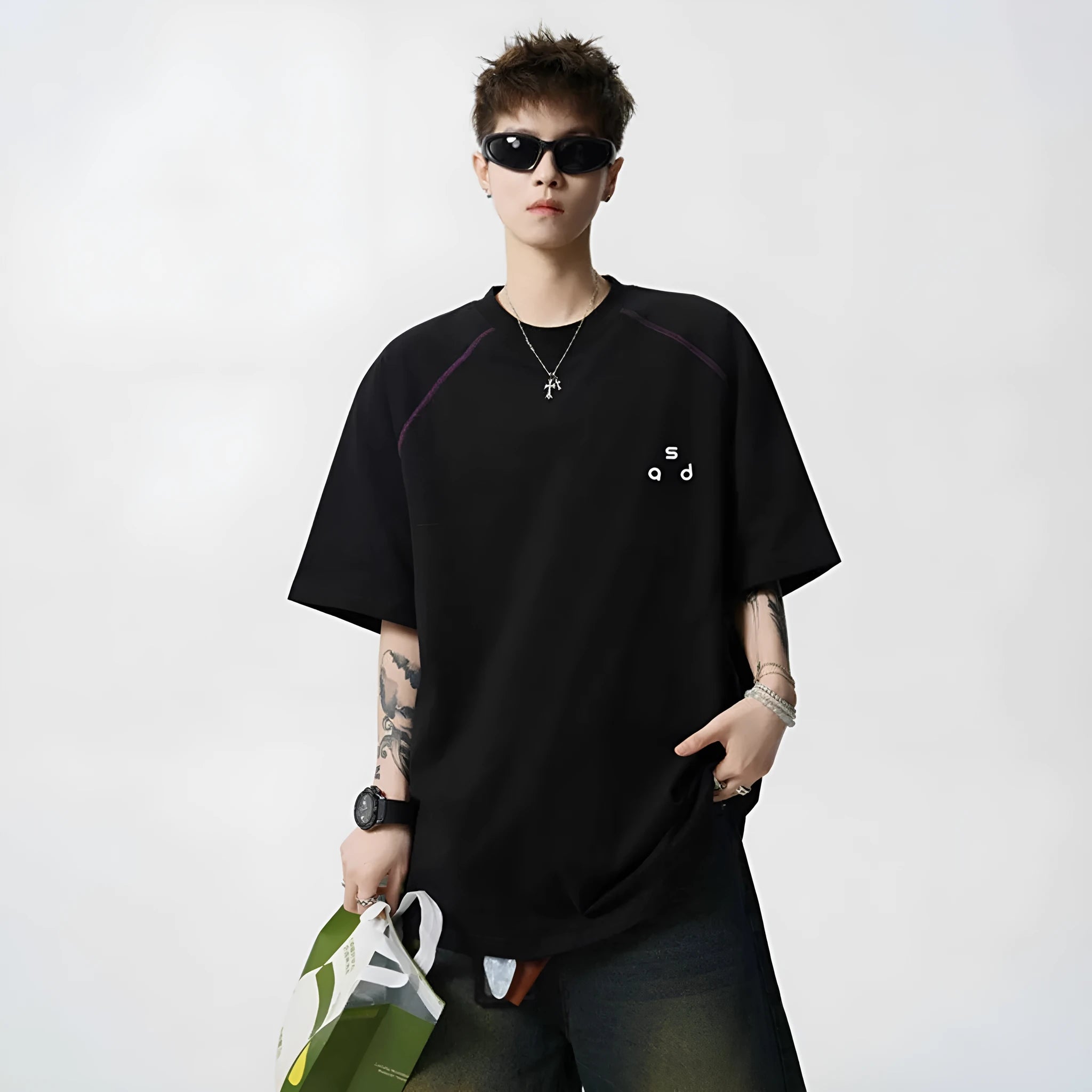 Loose fit cotton short sleeve t-shirt with letter print, shown in black and white colour options.