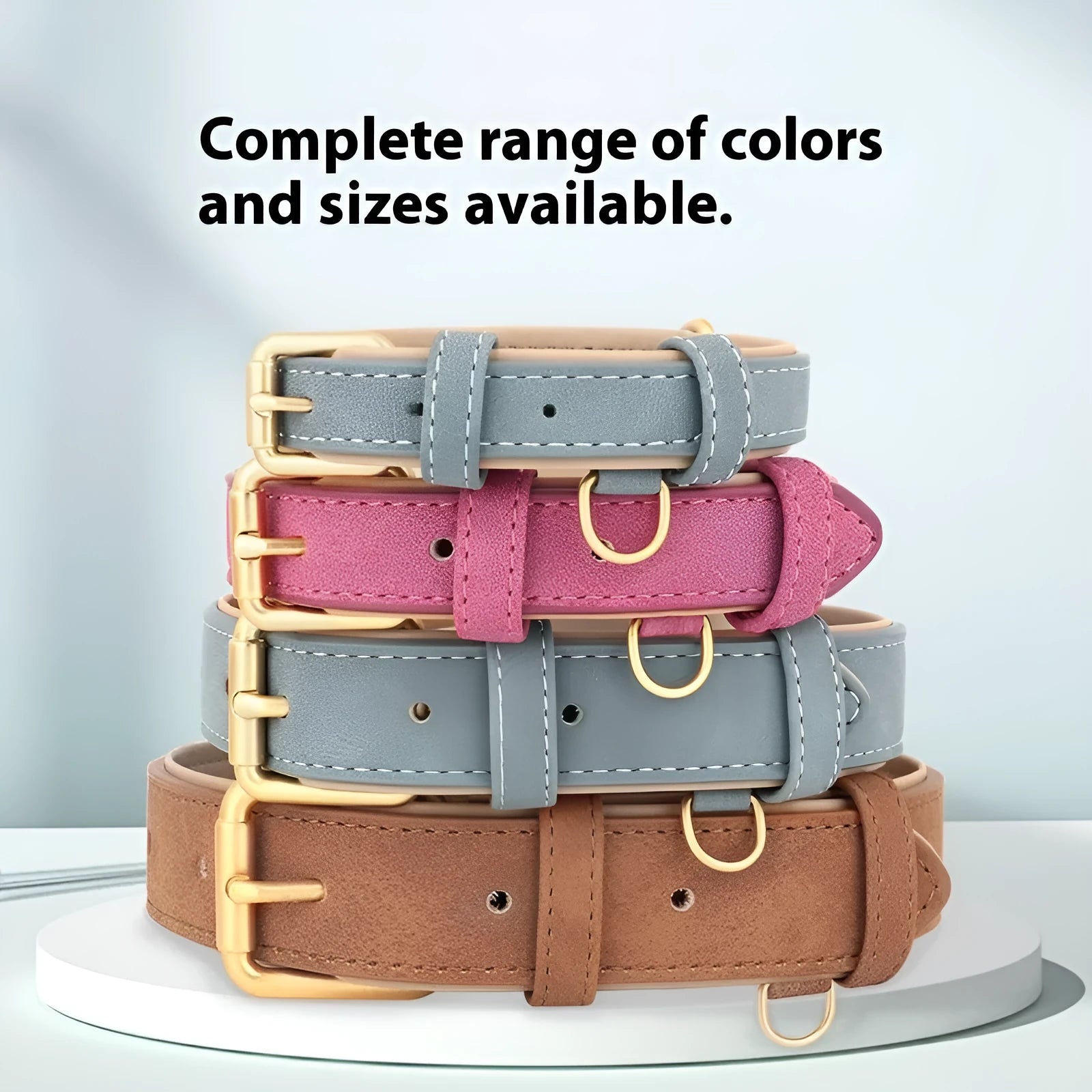 Double-layer brown leather dog collar with a matching lead on a grey background, showing the buckle and clip.