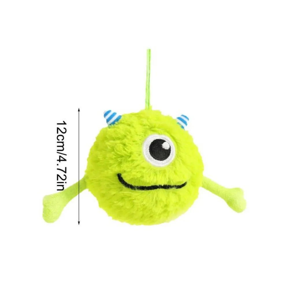 Green plush and TPR dog toy ball with bite-activated sound for teething puppies