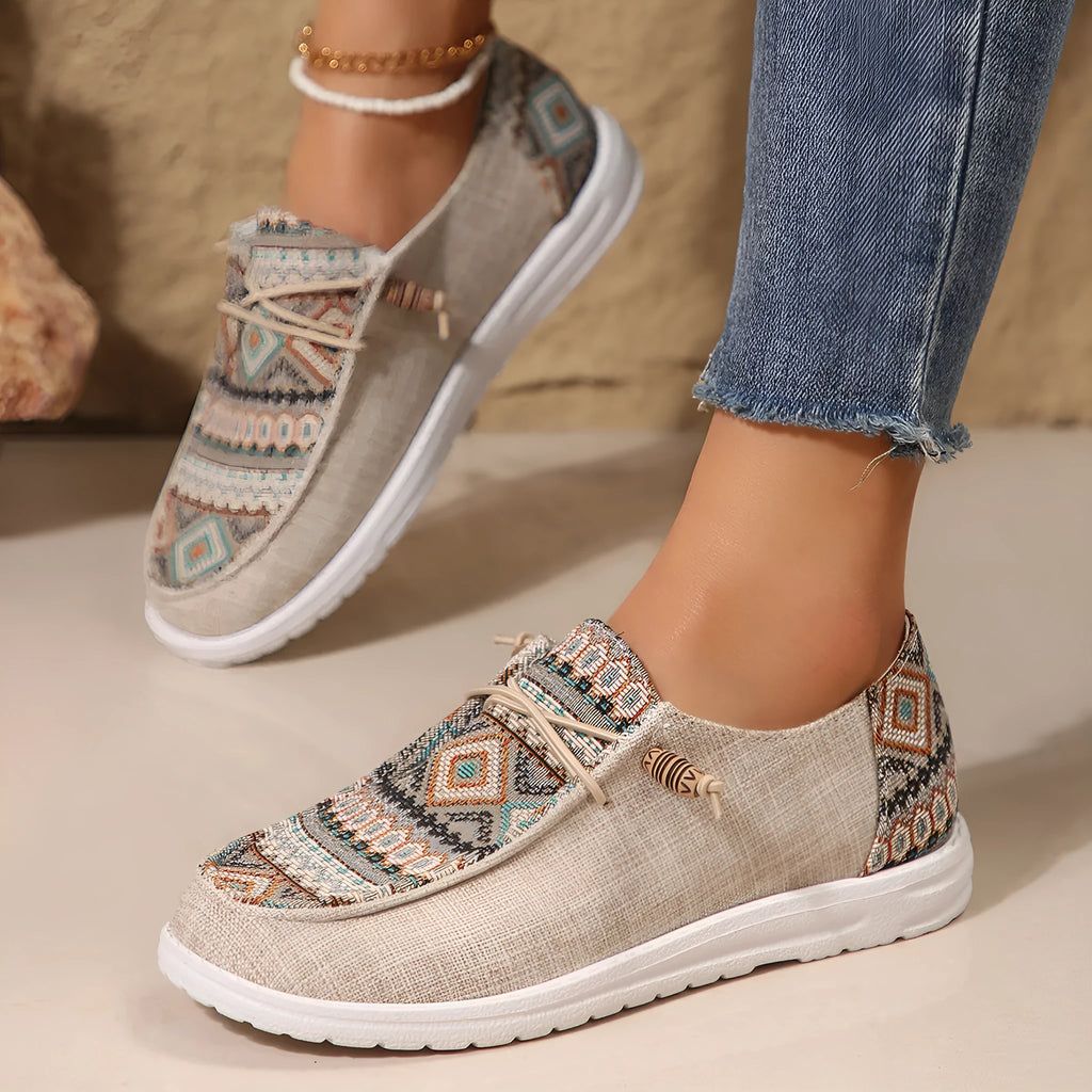 Women's black flat round toe low-top shoes with an oversleeve design on a white background.