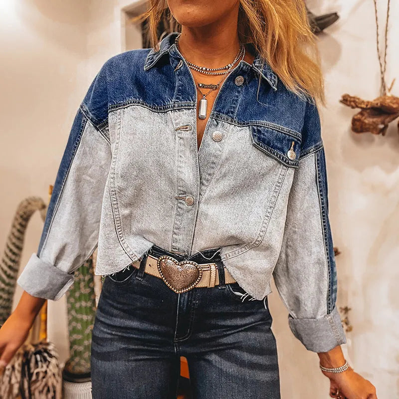 Women's blue denim coat with multi-buckle front closure and loose fit design