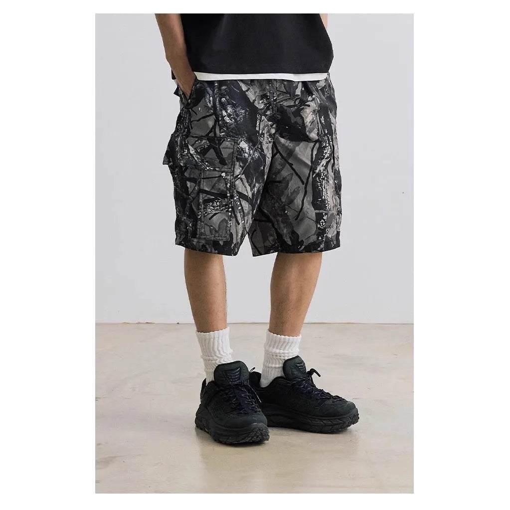 Army green loose fit straight-leg denim shorts with a mid waist and zip fly on a hanger.