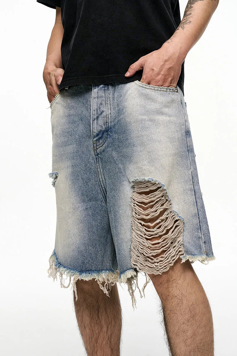 Men's light blue baggy denim shorts with wide legs and retro washed colour.