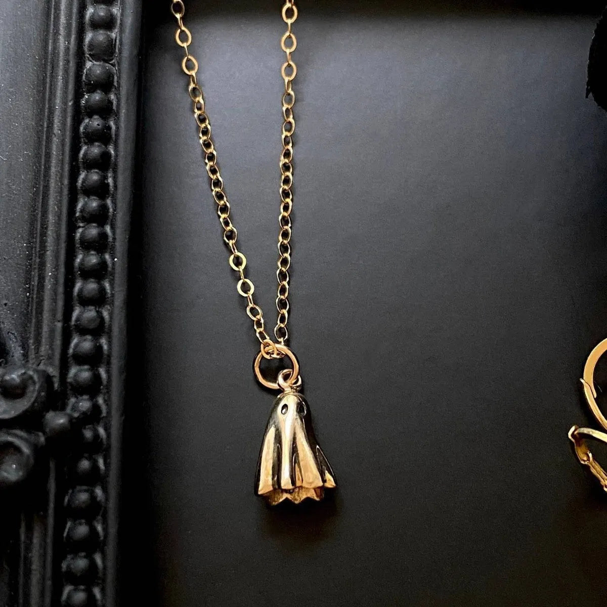 Ghost pendant necklace on a stainless steel chain with choice of cable, Figaro, or mini staple style.
