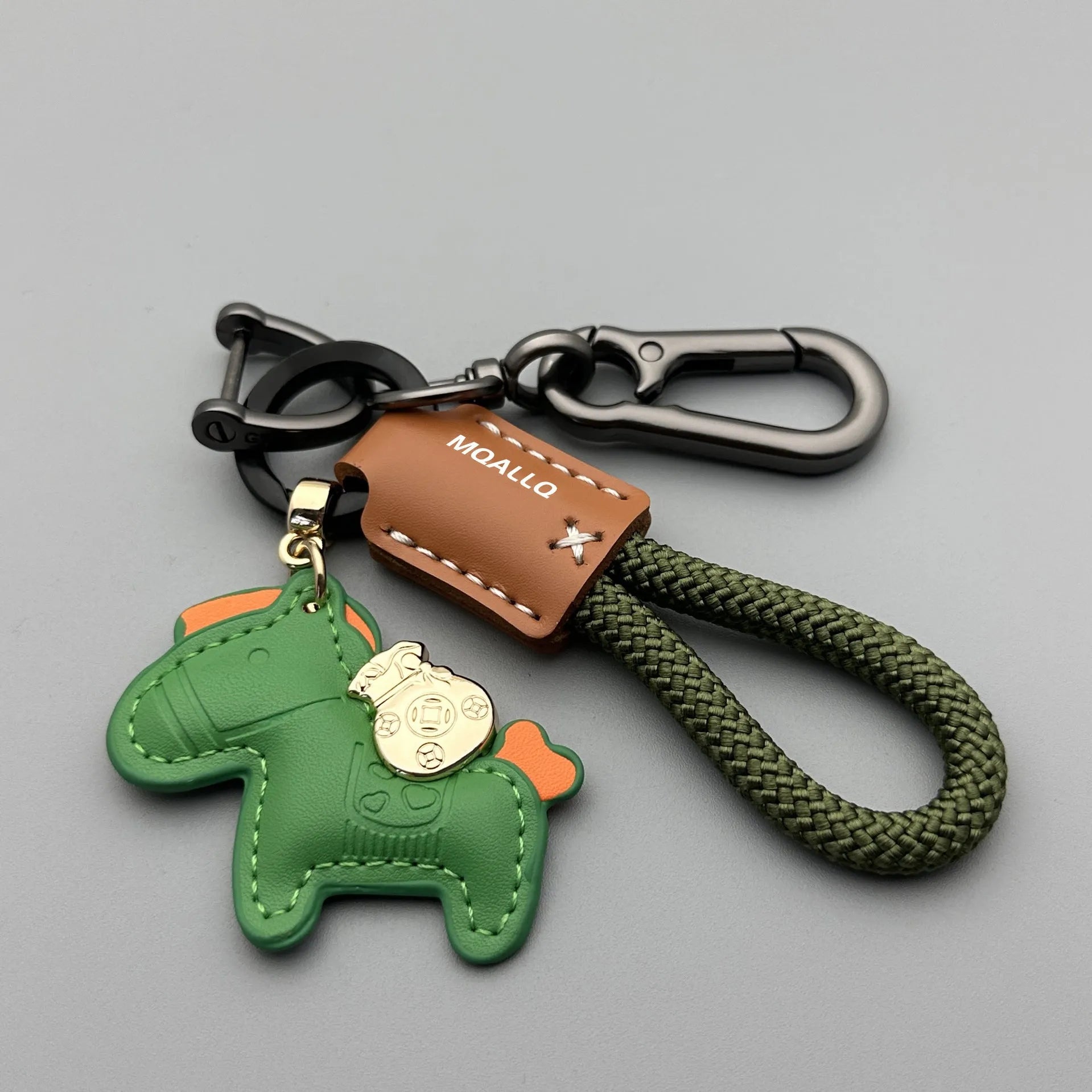 Handmade cowhide leather key ring pendant with zinc alloy pony buckle and coloured flanelle rope.