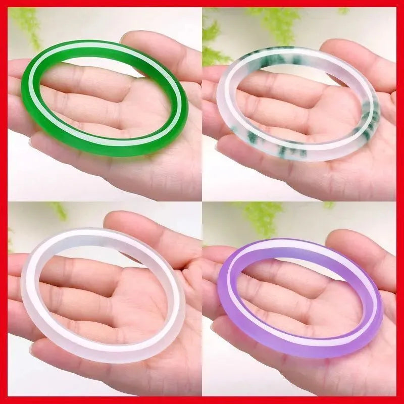 Jade bracelet with floating flower design and auspicious cloud patterns in green colour variation