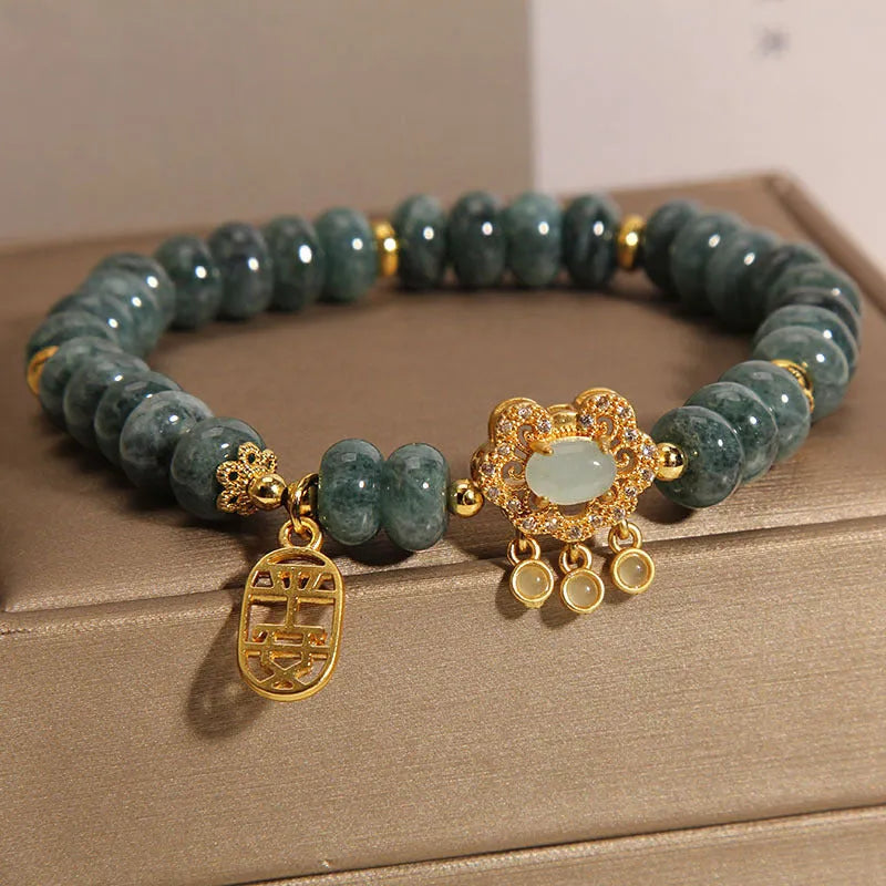 Women's bracelet with natural emerald jade abacus beads and alloy safety lock closure