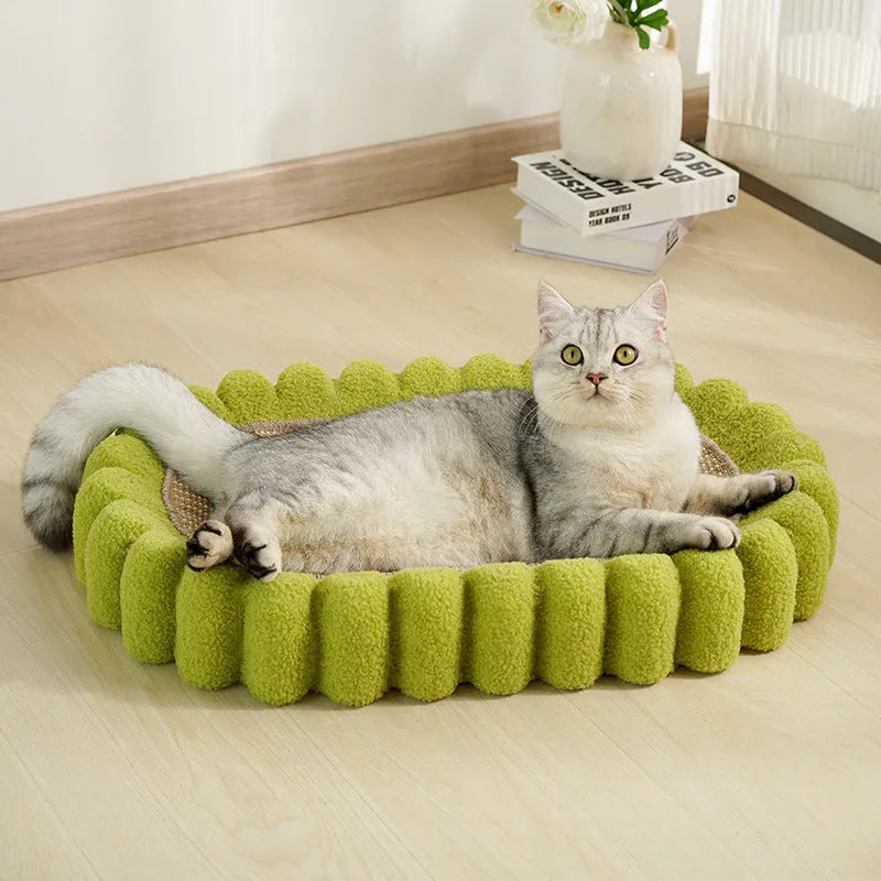 Green oval sisal cat scratching pad serving as a lounging bed with dimensions 650mm by 420mm.