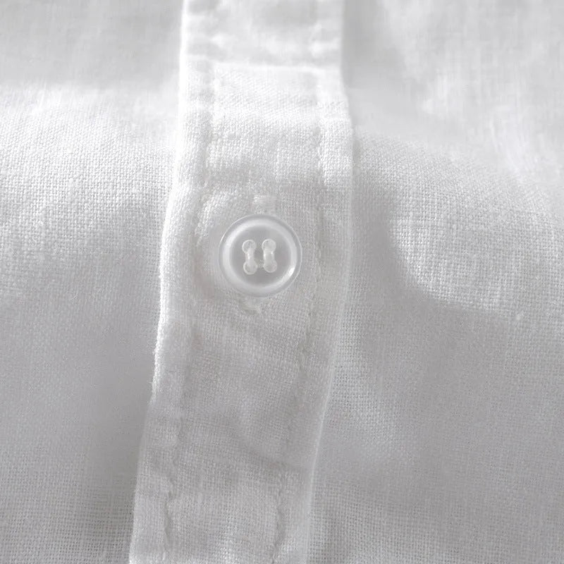 Men's loose fit short sleeve linen shirt in apricot colour on a hanger.