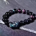 Natural ice colour obsidian crystal bead bracelet showing different bead size options on a wrist.