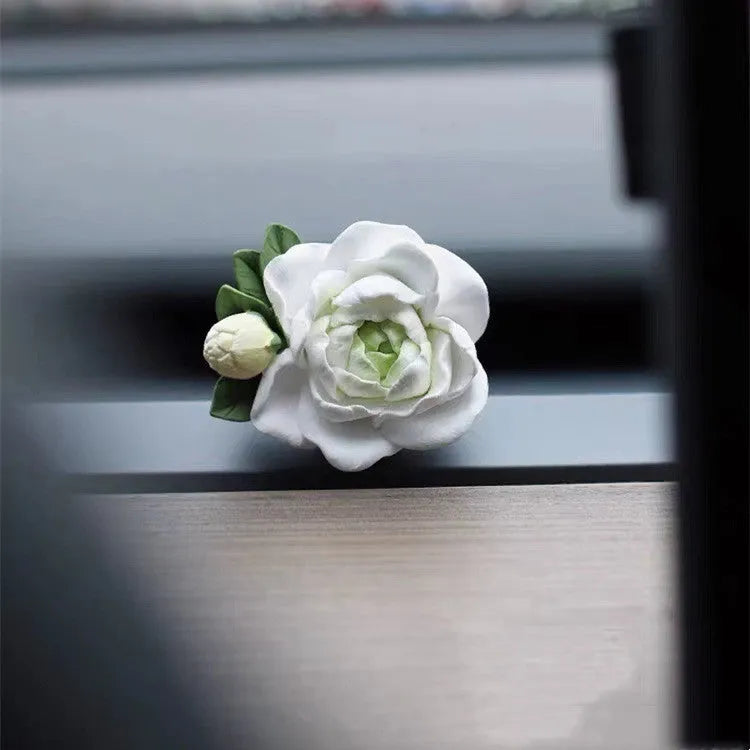 Jasmine car perfume solid air outlet freshener in off white or fresh green colour on car vent