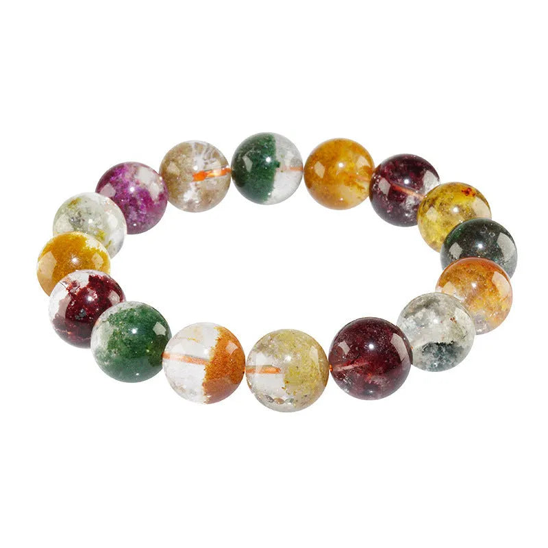 Natural crystal bracelet with 10mm beads showing ghost cornucopia ethnic design