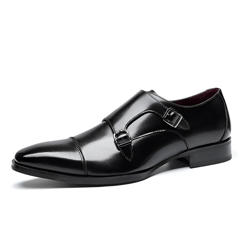 Men's black leather square toe casual shoes with metal accents on a rubber sole.