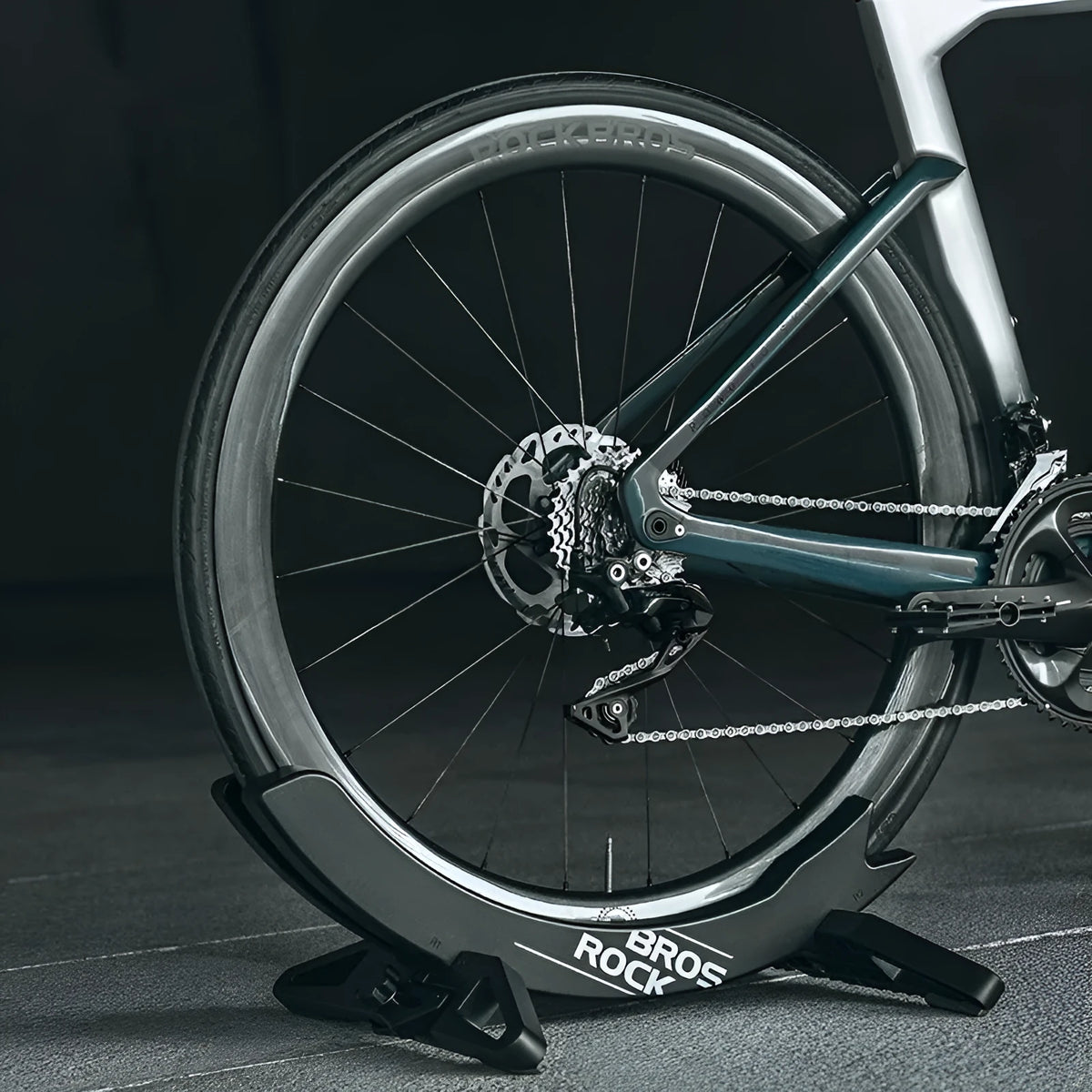 Black ABS plastic wall-mounted bike parking rack holder for road and mountain bicycles.