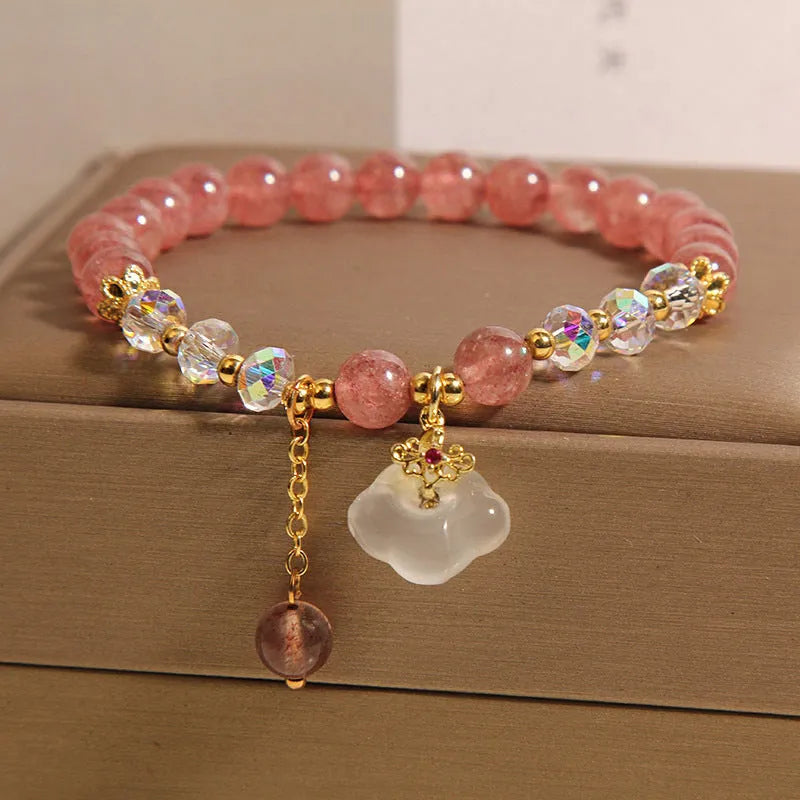 Women's crystal bracelet with strawberry quartz beads and white agate auspicious clouds design