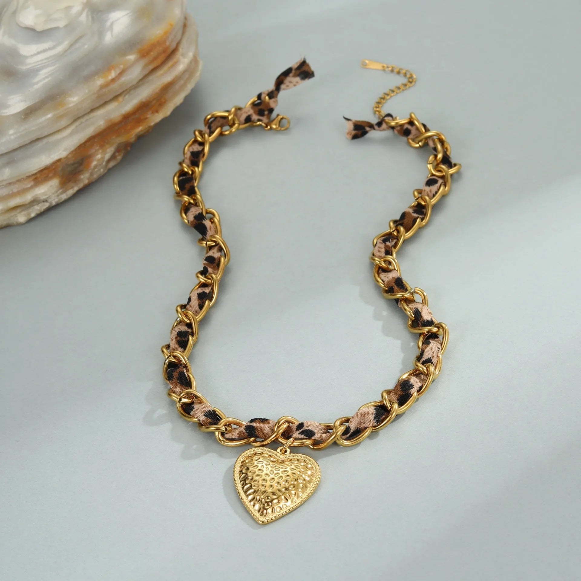 Stainless steel leopard love pendant necklace with geometric design and 18K gold electroplating on adjustable chain