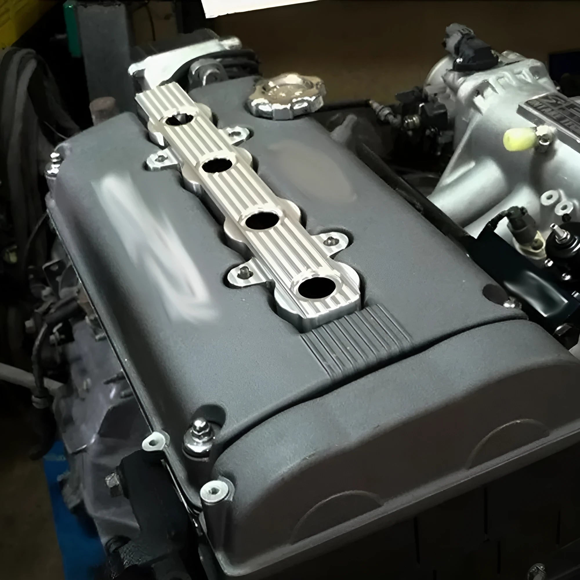 Aluminium alloy engine harness bracket for motorcycle engine housing in blue, red, and silver colour options
