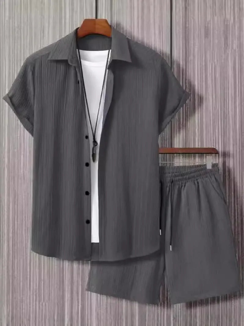 Mens black and white jacquard short sleeve shirt and matching shorts suit set on a hanger.